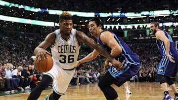 Apr 11, 2016; Boston, MA, USA; Boston Celtics guard Marcus Smart (36) controls the ball while Charlotte Hornets guard Jeremy Lin (7) defends during the second half at TD Garden. Mandatory Credit: Bob DeChiara-USA TODAY Sports