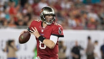 Nov 11, 2013; Tampa, FL, USA; Tampa Bay Buccaneers quarterback Mike Glennon (8) scrambles out of the pocket during the second half of the game against the Miami Dolphins at Raymond James Stadium. Mandatory Credit: Rob Foldy-USA TODAY Sports