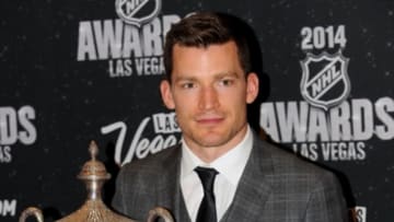 Jun 24, 2014; Las Vegas, NV, USA; Edmonton Oilers forward Andrew Ference poses with the King Clancy Memorial Trophy after being recognized for leadership excellence and his humanitarian contributions to his community throughout the season during the 2014 NHL Awards ceremony at Wynn Las Vegas. Mandatory Credit: Stephen R. Sylvanie-USA TODAY Sports