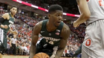 Feb 23, 2016; Columbus, OH, USA; Michigan State Spartans guard Eron Harris (14) fights for the rebound with Ohio State Buckeyes forward Marc Loving (2) during the first half versus the Ohio State Buckeyes at Value City Arena. The Spartans won 81-62. Mandatory Credit: Joe Maiorana-USA TODAY Sports