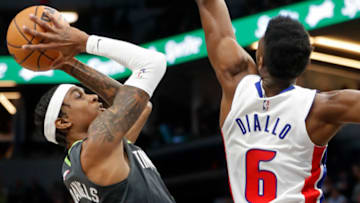 Minnesota Timberwolves forward Jaden McDaniels (3) shoots past Detroit Pistons forward Hamidou Diallo Credit: Bruce Kluckhohn-USA TODAY Sports