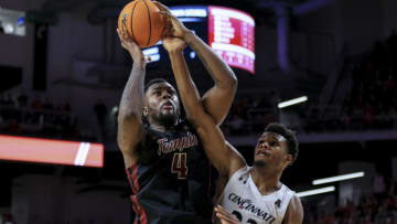 Temple Owls center Jamille Reynolds faces Cincinnati Bearcats forward Ody Oguama at Fifth Third Arena. USA Today.
