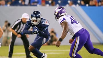 NASHVILLE, TN - AUGUST 30: Deontay Burnett #80 of the Tennessee Titans is pursued by Kentrell Brothers #40 of the Minnesota Vikings during the first half of a pre-season game at Nissan Stadium on August 30, 2018 in Nashville, Tennessee. (Photo by Frederick Breedon/Getty Images)