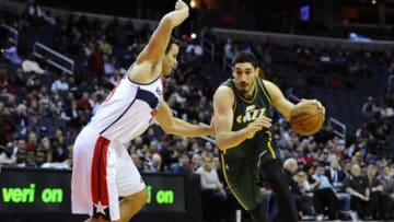 Dec 14, 2014; Washington, DC, USA; Utah Jazz center Enes Kanter (0) dribbles past Washington Wizards forward Kris Humphries (43) during the first half at Verizon Center. Mandatory Credit: Brad Mills-USA TODAY Sports