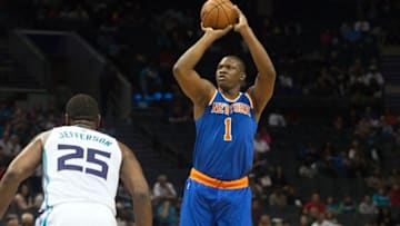 Oct 17, 2015; Charlotte, NC, USA; New York Knicks forward Kevin Seraphin (1) shoots the ball over Charlotte Hornets center Al Jefferson (25) during the first half at Time Warner Cable Arena. Mandatory Credit: Jeremy Brevard-USA TODAY Sports