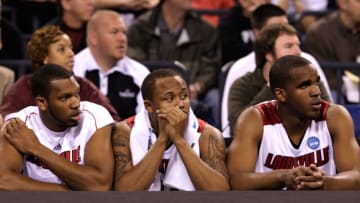 INDIANAPOLIS - MARCH 29: (L-R) George Goode #22, Jerry Smith #34 and Samardo Samuels #24 of the Louisville Cardinals look on dejected from the bench in the final minute of their 64-52 loss against the Michigan State Spartans during the fourth round of the NCAA Division I Men's Basketball Tournament at the Lucas Oil Stadium on March 29, 2009 in Indianapolis, Indiana. (Photo by Andy Lyons/Getty Images)