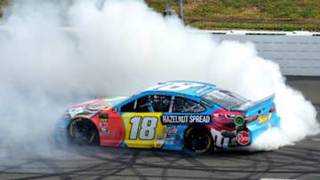 LONG POND, PENNSYLVANIA - JUNE 02: Kyle Busch, driver of the #18 M&M's Hazelnut Toyota, celebrates with a burnout after winning the Monster Energy NASCAR Cup Series Pocono 400 at Pocono Raceway on June 02, 2019 in Long Pond, Pennsylvania. (Photo by Jared C. Tilton/Getty Images)