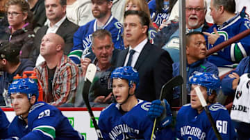 VANCOUVER, BC - OCTOBER 3: Head coach Travis Green of the Vancouver Canucks looks on from the bench during their NHL game against the Calgary Flames at Rogers Arena October 3, 2018 in Vancouver, British Columbia, Canada. (Photo by Jeff Vinnick/NHLI via Getty Images)"n