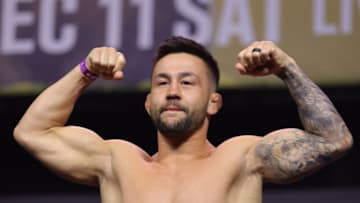 LAS VEGAS, NEVADA - DECEMBER 10: Pedro Munhoz of Brazil poses on the scale during the UFC 269 ceremonial weigh-in at MGM Grand Garden Arena on December 10, 2021 in Las Vegas, Nevada. (Photo by Carmen Mandato/Getty Images)