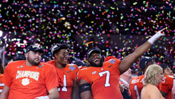 ARLINGTON, TEXAS - DECEMBER 29: Austin Bryant #7 of the Clemson Tigers celebrates with teammates after defeating the Notre Dame Fighting Irish during the College Football Playoff Semifinal Goodyear Cotton Bowl Classic at AT&T Stadium on December 29, 2018 in Arlington, Texas. Clemson defeated Notre Dame 30-3. (Photo by Tom Pennington/Getty Images)