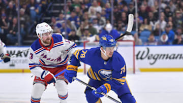 Mar 31, 2023; Buffalo, New York, USA; Buffalo Sabres defenseman Jacob Bryson (78) and New York Rangers left wing Alexis Lafrenière (13) skate after the puck in the second period at KeyBank Center. Mandatory Credit: Mark Konezny-USA TODAY Sports