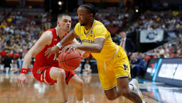 ANAHEIM, CALIFORNIA - MARCH 28: Zavier Simpson #3 of the Michigan Wolverines drives against Matt Mooney #13 of the Texas Tech Red Raiders during the 2019 NCAA Men's Basketball Tournament West Regional at Honda Center on March 28, 2019 in Anaheim, California. (Photo by Sean M. Haffey/Getty Images)