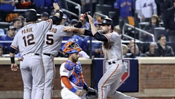 Oct 5, 2016; New York City, NY, USA; San Francisco Giants third baseman Conor Gillaspie (21) celebrates with second baseman Joe Panik (12) and shortstop Brandon Crawford (35) after hitting a three run home run during the ninth inning against the New York Mets in the National League wild card playoff baseball game at Citi Field. Mandatory Credit: Anthony Gruppuso-USA TODAY Sports