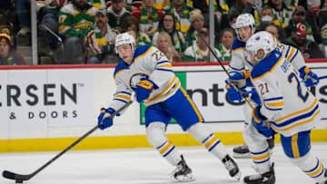 Jan 28, 2023; Saint Paul, Minnesota, USA; Buffalo Sabres right wing Jack Quinn (22) and right wing Kyle Okposo (21) lead the rush against the Minnesota Wild in the third period at Xcel Energy Center. Mandatory Credit: Matt Blewett-USA TODAY Sports