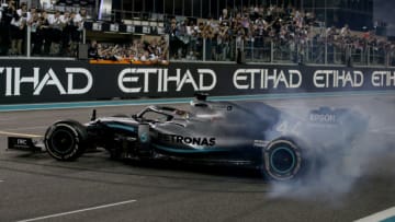 ABU DHABI, UNITED ARAB EMIRATES - DECEMBER 01: Race winner Lewis Hamilton of Great Britain and Mercedes GP celebrates with donuts on track during the F1 Grand Prix of Abu Dhabi at Yas Marina Circuit on December 01, 2019 in Abu Dhabi, United Arab Emirates. (Photo by Charles Coates/Getty Images)