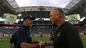 MIAMI GARDENS, FL - NOVEMBER 05: Head coaches Pat Narduzzi of the Pittsburgh Panthers and Mark Richt of the Miami Hurricanes shake hands after the game at Hard Rock Stadium on November 5, 2016 in Miami Gardens, Florida. (Photo by Rob Foldy/Getty Images)