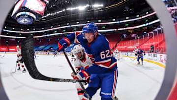 MONTREAL, QC - FEBRUARY 04: Artturi Lehkonen #62 of the Montreal Canadiens skates against Colin White #36 of the Ottawa Senators during the second period at the Bell Centre on February 4, 2021 in Montreal, Canada. (Photo by Minas Panagiotakis/Getty Images)