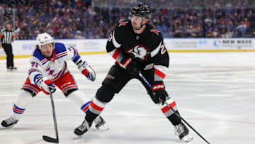 Mar 11, 2023; Buffalo, New York, USA; New York Rangers right wing Vladimir Tarasenko (91) tries to block shot by Buffalo Sabres defenseman Mattias Samuelsson (23) during the second period at KeyBank Center. Mandatory Credit: Timothy T. Ludwig-USA TODAY Sports
