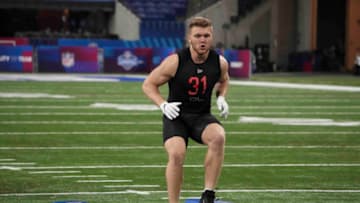 Mar 5, 2022; Indianapolis, IN, USA; Michigan defensive lineman Aidan Hutchinson (DL31) goes through drills during the 2022 NFL Scouting Combine at Lucas Oil Stadium. Mandatory Credit: Kirby Lee-USA TODAY Sports