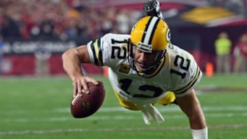 Jan 16, 2016; Glendale, AZ, USA; Green Bay Packers quarterback Aaron Rodgers (12) dives forward against the Arizona Cardinals during the first half in an NFC Divisional round playoff game at University of Phoenix Stadium. Mandatory Credit: Joe Camporeale-USA TODAY Sports