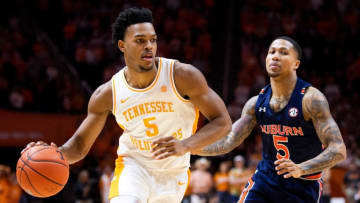 Tennessee guard Josiah-Jordan James (5) drives past Auburn guard J'Von McCormick (5) during a basketball game between the Tennessee Volunteers and the Auburn Tigers at Thompson-Boling Arena in Knoxville, Tenn., on Saturday, March 7, 2020.Kns Vols Hoops Auburn Bp Jpg