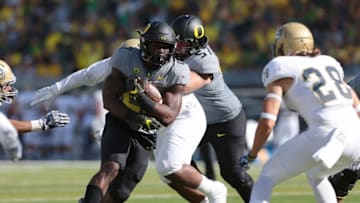 Sep 3, 2016; Eugene, OR, USA; UC Davis Aggies safety Ryan Parenteau (28) defends against Oregon Ducks running back Royce Freeman (21) in the third quarter at Autzen Stadium. Mandatory Credit: Scott Olmos-USA TODAY Sports