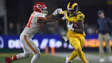 LOS ANGELES, CA - NOVEMBER 19: Todd Gurley #30 of the Los Angeles Rams fends off Dorian O'Daniel #44 of the Kansas City Chiefs during the third quarter of the game at Los Angeles Memorial Coliseum on November 19, 2018 in Los Angeles, California. (Photo by Kevork Djansezian/Getty Images)