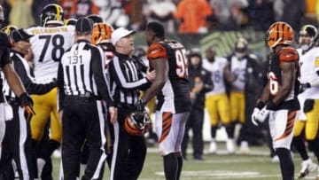 Jan 9, 2016; Cincinnati, OH, USA; Cincinnati Bengals defensive end Wallace Gilberry (95) talks with referee John Parry (132) during the fourth quarter against the Pittsburgh Steelers in the AFC Wild Card playoff football game at Paul Brown Stadium. Mandatory Credit: David Kohl-USA TODAY Sports
