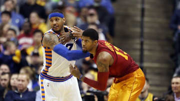 Feb 24, 2016; Indiana Pacers forward Paul George (13) is guarded by New York Knicks forward Carmelo Anthony (7) at Bankers Life Fieldhouse. Indiana defeats New York 108-105. Mandatory Credit: Brian Spurlock-USA TODAY Sports