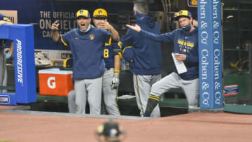 Sep 4, 2020; Cleveland, Ohio, USA; Milwaukee Brewers hitting coach Andy Haines (49), left and manager Craig Counsell (30) react to a strike call by home plate umpire Jerry Meals (41) in the seventh inning against the Cleveland Indians at Progressive Field. Haines was ejected from the game. Mandatory Credit: David Richard-USA TODAY Sports