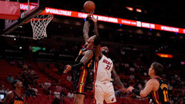 Oct 4, 2021; Miami, Florida, USA; Atlanta Hawks forward John Collins (20) and Miami Heat center Dewayne Dedmon (21) battle for a rebound during the second half at FTX Arena. Mandatory Credit: Jasen Vinlove-USA TODAY Sports