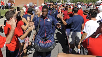 Oct 24, 2015; Tucson, AZ, USA; Arizona Wildcats running back Nick Wilson (28) high fives fans during the Wildcat Walk before the game against the Washington State Cougars at Arizona Stadium. Mandatory Credit: Casey Sapio-USA TODAY Sports