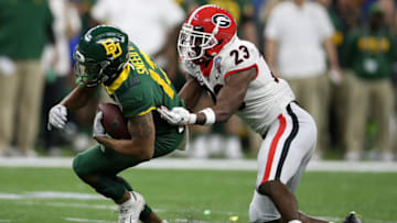 NEW ORLEANS, LOUISIANA - JANUARY 01: R.J. Sneed #13 of the Baylor Bears is tackled by Mark Webb #23 of the Georgia Bulldogs during the Allstate Sugar Bowl at Mercedes Benz Superdome on January 01, 2020 in New Orleans, Louisiana. (Photo by Chris Graythen/Getty Images)