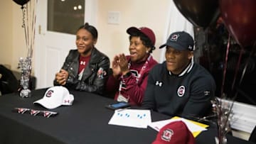 DeMatha Catholic's Marshawn Lloyd, right signs for South Carolina to play football during a signing day ceremony Wednesday night in Delaware City.Sports Signing Day