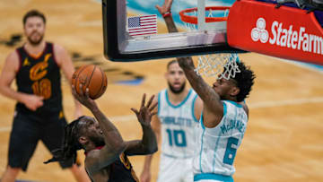 Apr 14, 2021; Charlotte, North Carolina, USA; Cleveland Cavaliers forward Taurean Prince (12) goes up for a basket guarded by Charlotte Hornets forward Jalen McDaniels (6) during the second quarter at the Spectrum Center. Mandatory Credit: Jim Dedmon-USA TODAY Sports