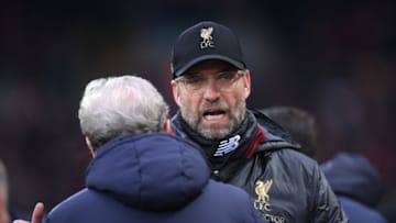 LIVERPOOL, ENGLAND - JANUARY 19: Jurgen Klopp, Manager of Liverpool embraces Roy Hodgson, Manager of Crystal Palace prior to the Premier League match between Liverpool FC and Crystal Palace at Anfield on January 19, 2019 in Liverpool, United Kingdom. (Photo by Laurence Griffiths/Getty Images)