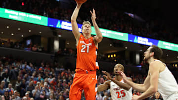 CHARLOTTESVILLE, VA - JANUARY 11: Marek Dolezaj #21 of the Syracuse Orange shoots over Mamadi Diakite #25 and Jay Huff #30 of the Virginia Cavaliers in the first half during a game at John Paul Jones Arena on January 11, 2020 in Charlottesville, Virginia. (Photo by Ryan M. Kelly/Getty Images)