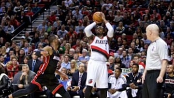 Jan 8, 2015; Portland, OR, USA; Portland Trail Blazers guard Wesley Matthews (2) shoots a three point basket over Miami Heat guard Dwyane Wade (3) during the fourth quarter at the Moda Center. Mandatory Credit: Craig Mitchelldyer-USA TODAY Sports