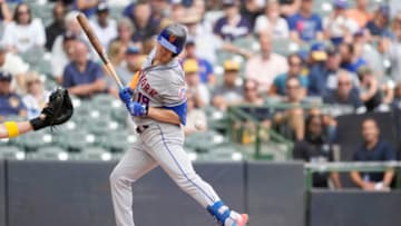 MILWAUKEE, WISCONSIN - SEPTEMBER 21: Mark Canha #19 of the New York Mets is hit by a pitch by Adrian Houser #37 of the Milwaukee Brewers in the fifth inning during a game at American Family Field on September 21, 2022 in Milwaukee, Wisconsin. (Photo by Patrick McDermott/Getty Images)
