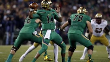 Nov 21, 2015; Boston, MA, USA; Notre Dame Fighting Irish quarterback DeShone Kizer (14) prepares to make a pass during the third quarter against the Boston College Eagles at Fenway Park. Mandatory Credit: Greg M. Cooper-USA TODAY Sports
