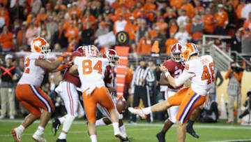 SANTA CLARA, CA - JANUARY 07: Will Spiers #48 of the Clemson Tigers punts the ball against the Alabama Crimson Tide in the CFP National Championship presented by AT&T at Levi's Stadium on January 7, 2019 in Santa Clara, California. (Photo by Sean M. Haffey/Getty Images)
