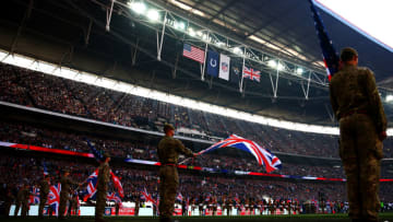 LONDON, ENGLAND - OCTOBER 02: Members of the armed forces hold the national flags of the United Kingdom and the United States before the start of the during the NFL game between Indianapolis Colts and Jacksonville Jaguars at Wembley Stadium on October 2, 2016 in London, England. (Photo by Dan Istitene/Getty Images)