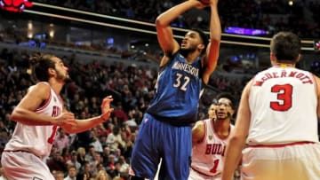 Nov 7, 2015; Chicago, IL, USA; Minnesota Timberwolves center Karl-Anthony Towns (32) shoots over Chicago Bulls center Joakim Noah (13) during the second half at the United Center. Minnesota defeated Chicago 102-93 in overtime. Mandatory Credit: David Banks-USA TODAY Sports