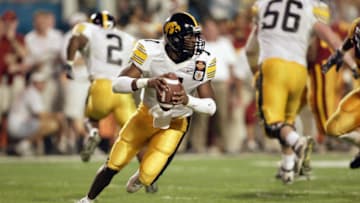 MIAMI - JANUARY 2: Brad Banks #7 of Iowa rolls out against USC during the FedEx Orange Bowl at Pro Player Stadium on January 2, 2003 in Miami, Florida. USC defeated Iowa 38-17. (Photo by Andy Lyons/Getty Images)