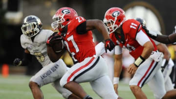 Sep 12, 2015; Nashville, TN, USA; Georgia Bulldogs running back Nick Chubb (27) runs for a first down during the second half against the Vanderbilt Commodores at Vanderbilt Stadium. Georgia won 31-14. Mandatory Credit: Christopher Hanewinckel-USA TODAY Sports
