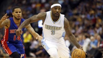 Oct 29, 2014; Denver, CO, USA; Denver Nuggets guard Ty Lawson (3) brings the ball up the court against Detroit Pistons guard D.J. Augustin (14) during the first half at Pepsi Center. Mandatory Credit: Chris Humphreys-USA TODAY Sports