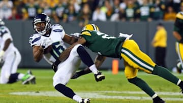 Sep 20, 2015; Green Bay, WI, USA; Seattle Seahawks wide receiver Tyler Lockett (16) is tackled by Green Bay Packers free safety Ha Ha Clinton-Dix (21) during the second half at Lambeau Field. Mandatory Credit: Ray Carlin-USA TODAY Sports