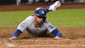 PHOENIX, AZ - SEPTEMBER 24: Tim Locastro #70 of the Los Angeles Dodgers scores on a single by teammate Max Muncy #13 during the seventh inning against the Arizona Diamondbacks at Chase Field on September 24, 2018 in Phoenix, Arizona. (Photo by Norm Hall/Getty Images)