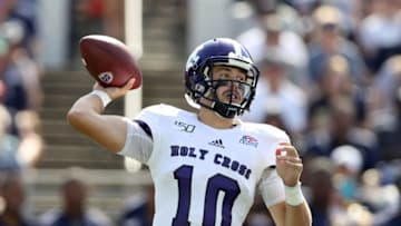 ANNAPOLIS, MARYLAND - AUGUST 31: Quarterback Connor Degenhardt #10 of the Holy Cross Crusaders looks to pass against the Navy Midshipmen in the first half at Navy-Marine Corps Memorial Stadium on August 31, 2019 in Annapolis, Maryland. (Photo by Rob Carr/Getty Images)