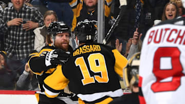 PITTSBURGH, PA - MARCH 23: Phil Kessel #81 of the Pittsburgh Penguins celebrates his third period goal with Derick Brassard #19 of the Pittsburgh Penguins against the New Jersey Devils at PPG Paints Arena on March 23, 2018 in Pittsburgh, Pennsylvania. (Photo by Joe Sargent/NHLI via Getty Images)